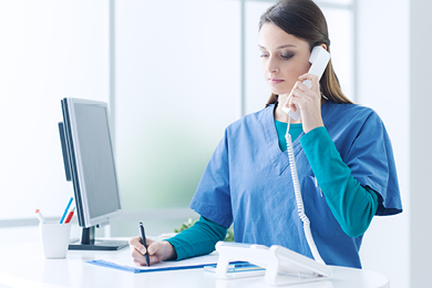 doctor on phone taking notes