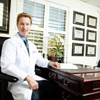 2_3ee252e5-7c35-4816-b91a-9e1889c22b63 doctor at desk smiling